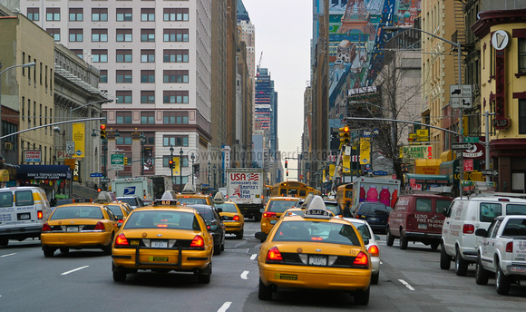 avenue with yellow cabs